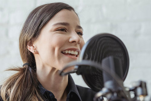 woman speaking into microphone